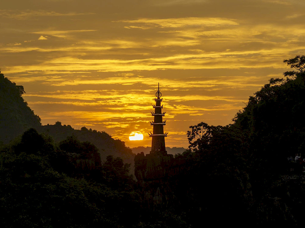 Golden hour magic: Watch the sun melt behind Ninh Binh&rsquo;s limestone mountains from the summit 